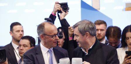 Friedrich Merz, leader of the Christian Democratic Union (CDU), left, and Markus Soeder, leader of the Christian Social Union (CSU), hold steins during a general election campaign rally in Munich, Germany, on Saturday, Feb. 22, 2025. Conservative frontrunnerMerzstepped up his attacks on rivalRobert Habeckfrom the Greens as the campaign ahead of Germany#{emoji}146;s federal election enters the final stretch. Photographer: Michaela Stache/Bloomberg